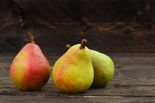 Pears on a rustic wooden kitchen table