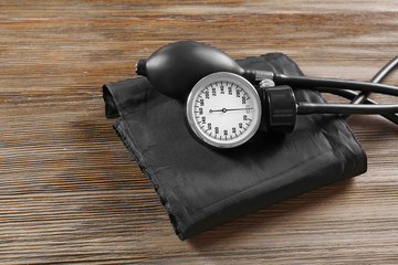 Medical manometer on a wooden background