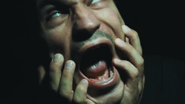 Horror scene with suffering man have many terrible faces