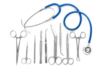 Flat lay of surgery instruments on white background