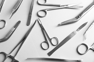 Flat lay of medical instruments on white background
