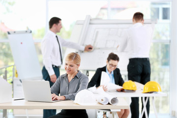 Fototapeta premium Group of creative engineers planning new project in office