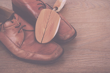 Shoes on a wooden floor Vintage Retro Filter.