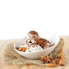 Food background. Scoops of ice cream with nuts and chocolate