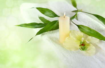 Wellness or spa motiv with bamboo and candles in green
