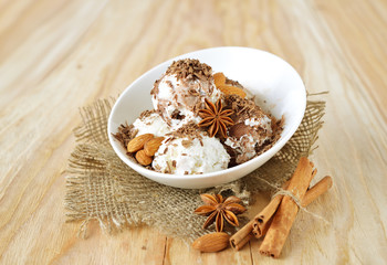 Delicious nut ice cream scoops with cinnamon and chocolate