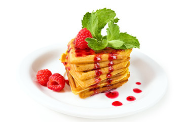 breakfast - waffles with syrup, mint and raspberries