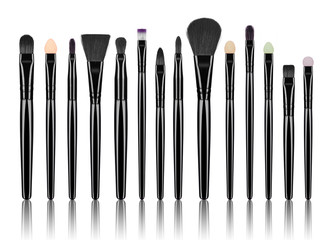 set of professional makeup brushes isolated on white background