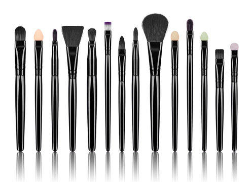 Fototapeta set of professional makeup brushes isolated on white background