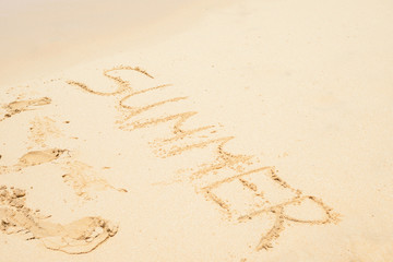 Flat sand and summer letters