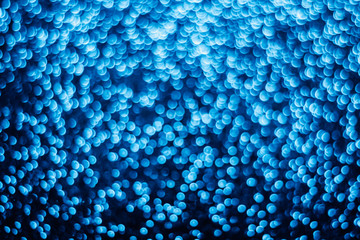 Blue glitter blurry background.