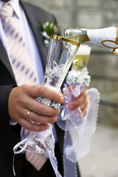 pouring champagne to wineglass