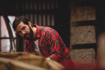 Man preparing wooden boat frame