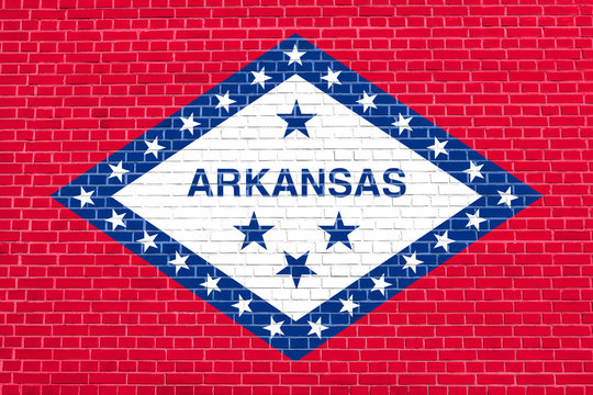 Flag of Arkansas on brick wall texture background