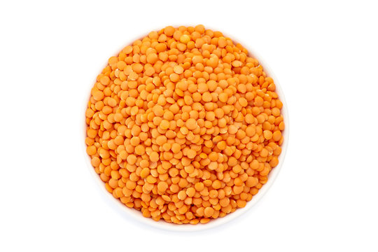 Bowl with red lentils on white