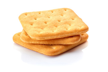 Three salted crackers on white
