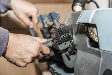 Master handles fine detail on a lathe in the workshop