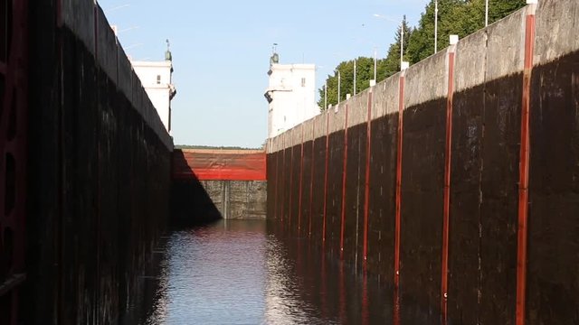 Ship enters the river gateway on the Svir River in the north of Russia