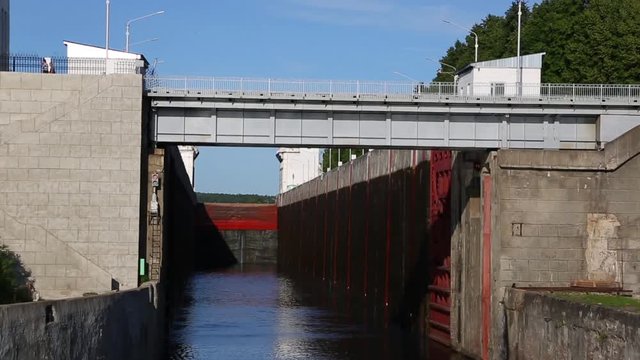Ship enters the river gateway on the Svir River in the north of Russia