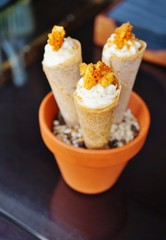 Savory food presented in an edible cone