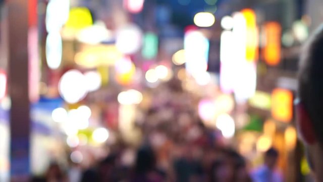 Crowds of Japanese and tourist at night walking at Takeshita street, Harajuku, Tokyo, Japan. 
