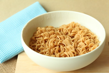 Instant noodles on wood board.