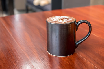 Hot chocolate in black cup