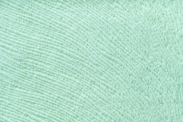 Mint background from soft textile material. Fabric with natural texture.
