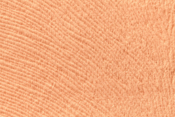 Coral background from soft textile material. Fabric with natural texture.