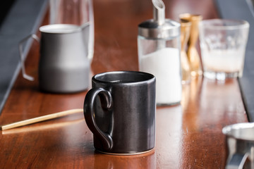 Black cup of hot water