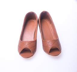 shoe. Brown colour fashion woman shoes on a background.