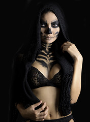 woman in day of the dead mask skull face art. Halloween face art