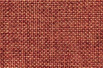 Bright orahge textile background closeup. Structure of the fabric macro