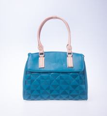 bag. blue colour fashion woman bag on a background.