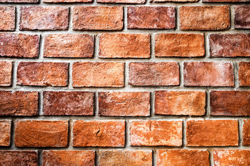Orange red dark dense wall brick background