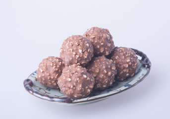 chocolate ball or chocolate bonbon on a background.