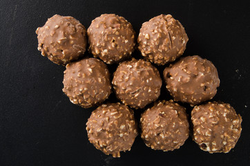 chocolate ball or chocolate bonbon on a background.