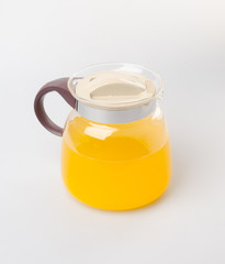 Orange juice in jar on a background.