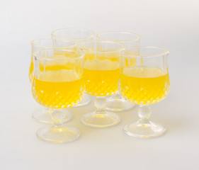 Orange juice in glasses on white background.