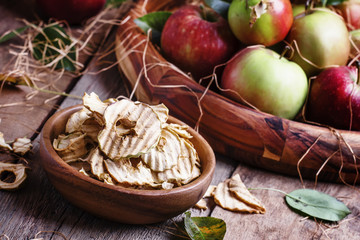 Healthy food: apple chips and fresh apples, decorations in the r