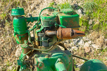 Old green bulldozer on a construction site