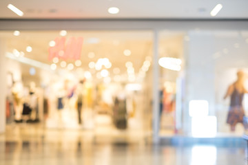 blur image of eletronic department store with bokeh for background usage