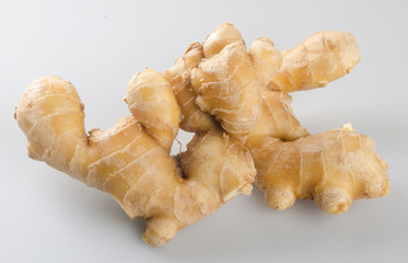 Ginger or fresh ginger on a background.