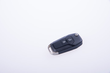 key or car key with remote on background.