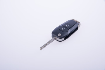 key or car key with remote on background.