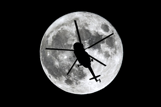 Full Moon helicopter silhouette