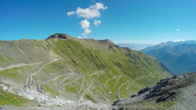 Thousand of cyclists climbing up the spectacular Stelvio Pass in the Alps on annual cycling day