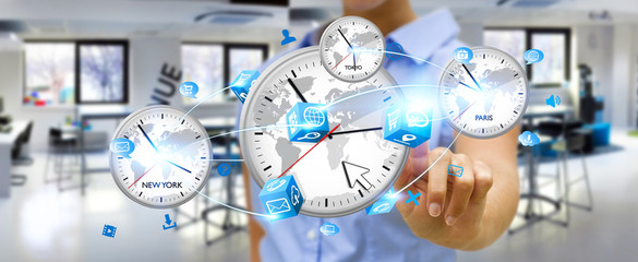 Businesswoman connecting time of the world in his hand