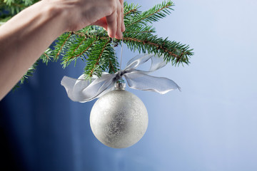 Shiny white decoration hanging on Christmas tree - Close up