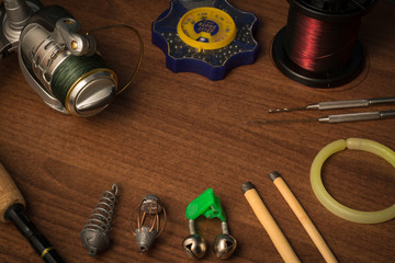 Fishing tools on wooden background
